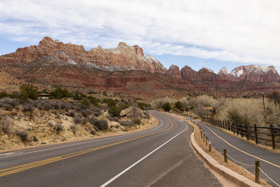 Road and bicycle path going through springdale towards zion national park with beautiful mountains