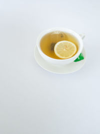 Directly above shot of tea cup against white background