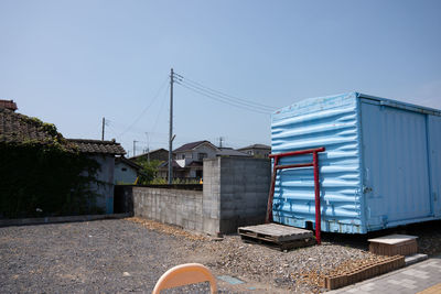 Buildings against clear blue sky