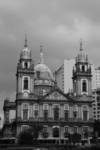 Low angle view of building against cloudy sky