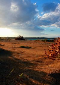Scenic view of sea against cloudy sky