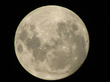 Low angle view of moon against sky at night