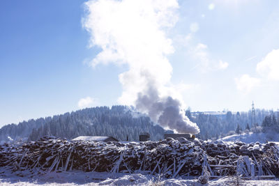 Air pollution smoke from factory chimney at rural nature in winter