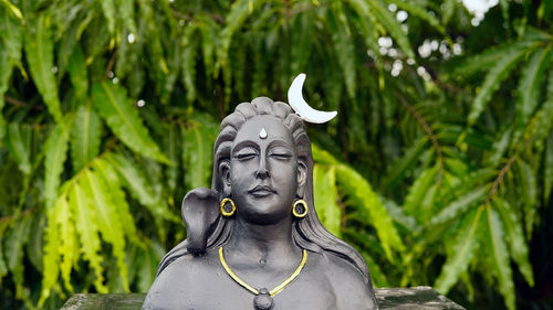 Lord ganesha, adiyogi and maa durga idol or statue isolated at green leaves background. indian 