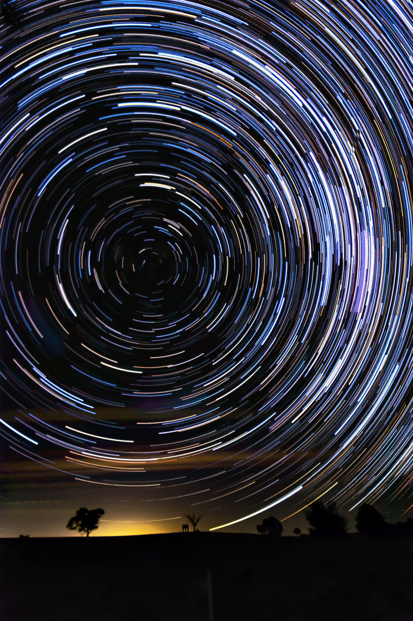 LOW ANGLE VIEW OF ILLUMINATED SKY