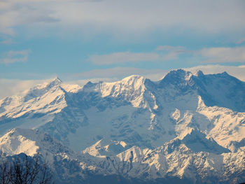 Scenic view of snowcapped mountains against sky