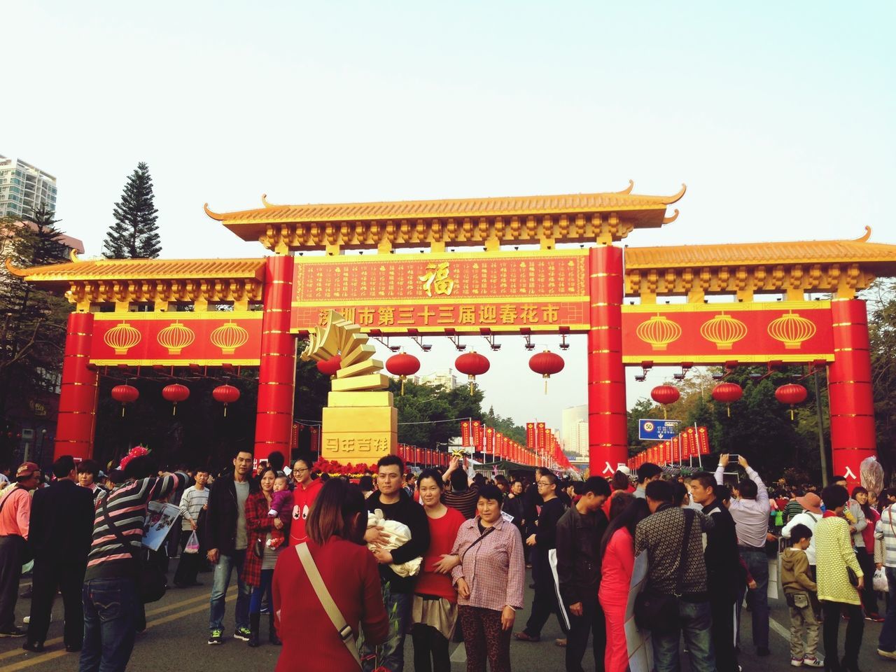 architecture, built structure, large group of people, building exterior, clear sky, person, religion, temple - building, cultures, tradition, men, culture, red, place of worship, temple, lifestyles, travel destinations, spirituality