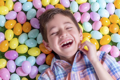 Portrait of smiling boy with balloons