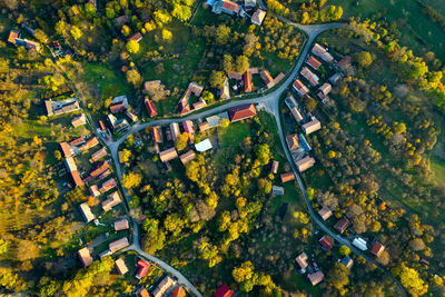 High angle aerial view of a small village, autumn countryside in transylvania, romania