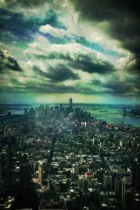 Cityscape against cloudy sky
