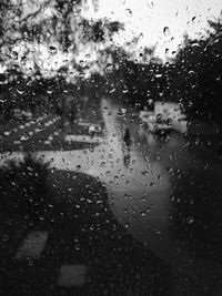 Full frame shot of wet glass window in rainy season