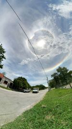 Cars on road against sky