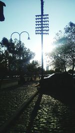 Low angle view of street light against sky