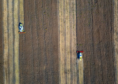 Aerial view of agricultural machinery working at farm