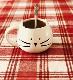 High angle view of coffee cup on table