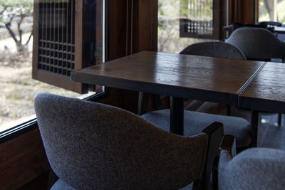 Empty chairs and table at cafe