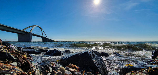 Bridge over sea against sky