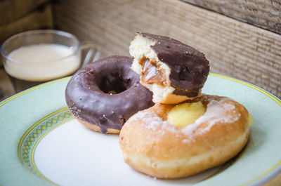 Close-up of chocolate donuts in plate