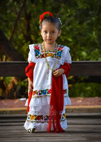 Portrait of cute girl standing outdoors