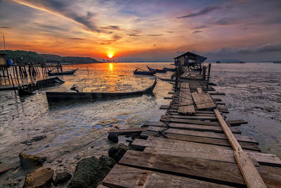 Beautiful sunrise view from an old fisherman jetty during low tide period. 