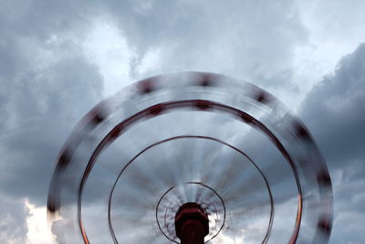 Low angle view of crystal ball against sky