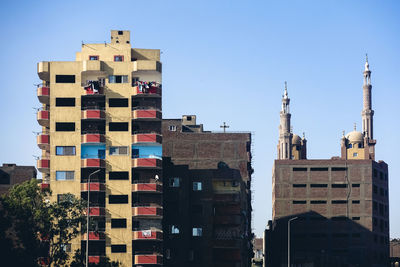 Low angle view of buildings against clear sky