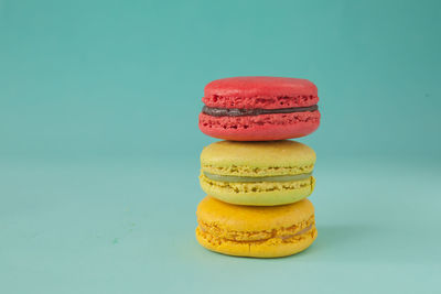 Close-up of multi colored candies against white background