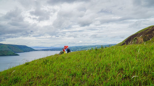 Scenic view of sea against cloudy sky