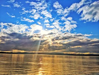 Scenic view of lake against sky during sunset