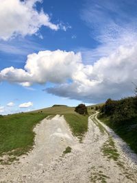 Panoramic view of road amidst land against sky