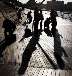 High angle view of people shadow on road