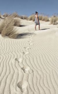 Full length of man on sand at beach