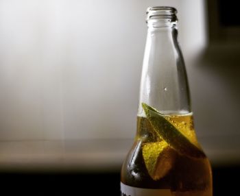 Close-up of beer bottle on table