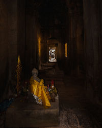 Statue outside temple in building