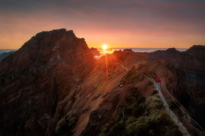 Scenic view of mountains against sky during sunset