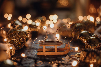 Close-up of illuminated christmas lights on table