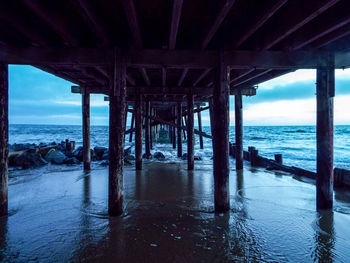 View of pier over sea against sky