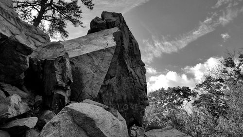 Low angle view of rock formations against sky