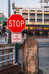 Stop sign on alaskan way in seattle with yield to pedestrians sign at pier 70 on the waterfront