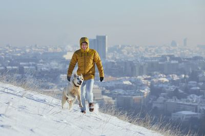 View of a dog standing on snow