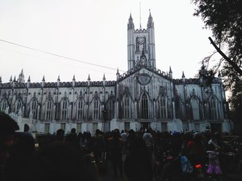 Group of people in front of historic building