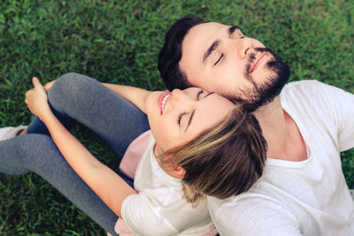 High angle view of woman lying on grassland