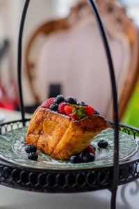 Delicious honey toast bread with fresh berries and strawberry on table.close-up