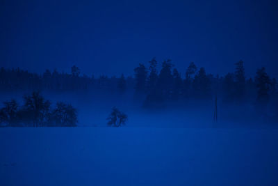 Dark winter scenery in early morning. snowy landscape during twilight.