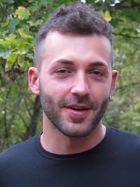 Close-up portrait of smiling young man