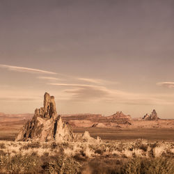 Scenic view of desert against sky during sunset