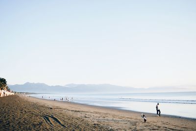 Scenic view of beach against clear sky