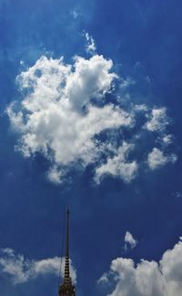 Low angle view of building against cloudy sky