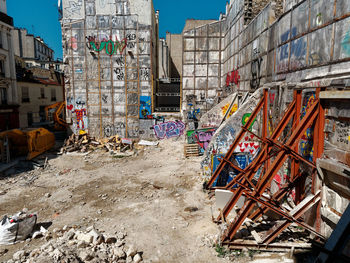 View of construction site by buildings in city