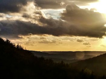 Scenic view of silhouette landscape against sky during sunset